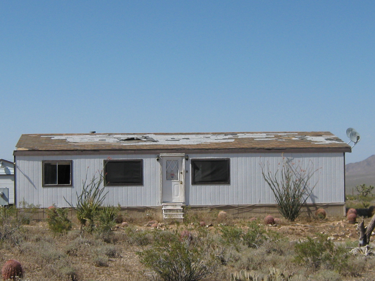 mobile home roof damaged by wind and water